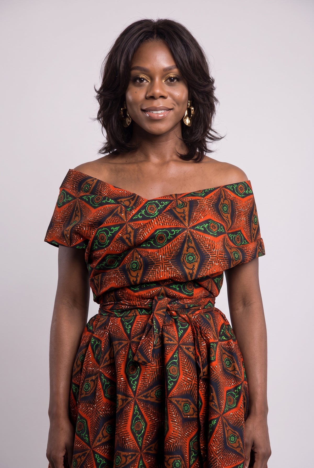 Three quarter view of Copper Star African print wedding guest dress