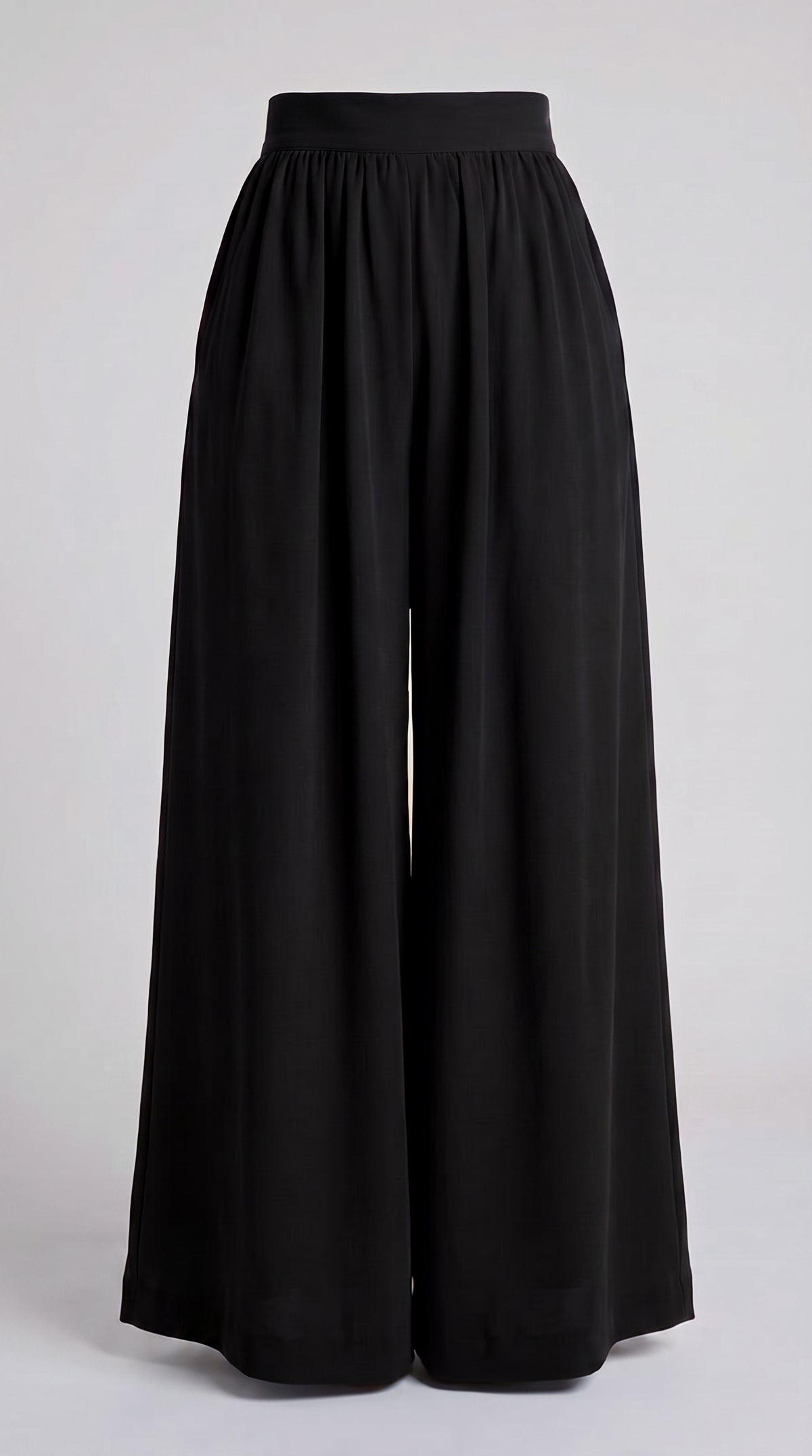 Black wide-leg cropped pants with a gathered elastic waistband, shown against a light gray studio background.