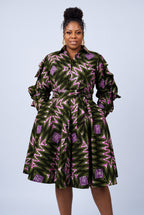 Half-length front view of green African print shirt dress with ruffle sleeves