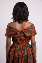 Back view of orange African print off shoulder midi dress
