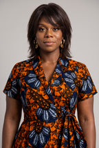 Close-up of V-neckline and collar on orange Ankara wrap dress 