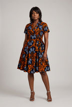 Full-length front view of African wax print wrap dress with pockets 
