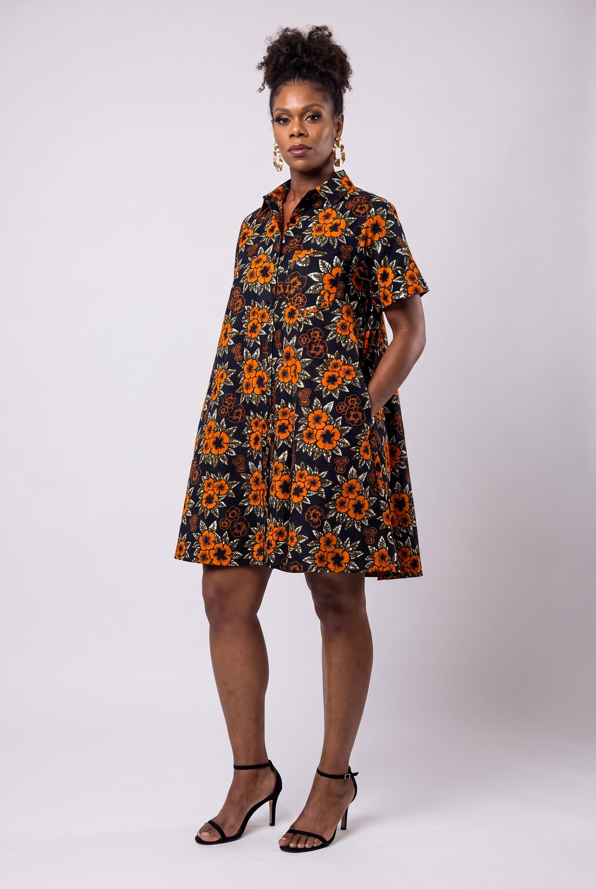 Three quarter view of Amber Bloom African print swing shirt dress