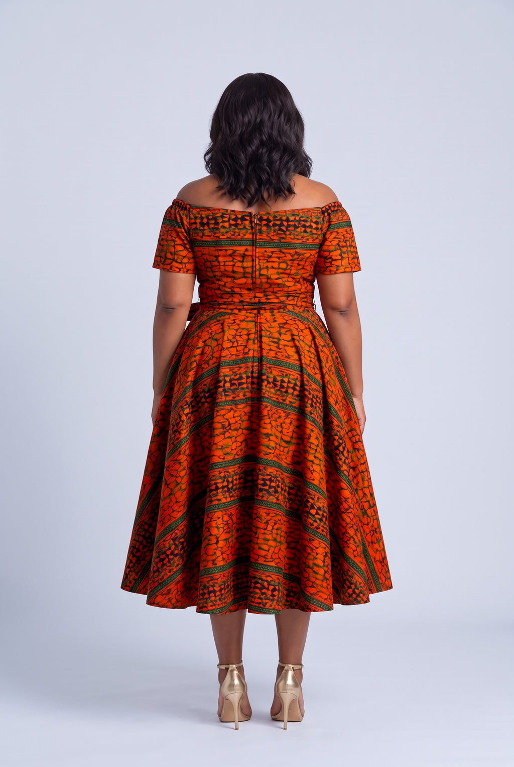  Back view of Amber Horizon orange African print off shoulder dress