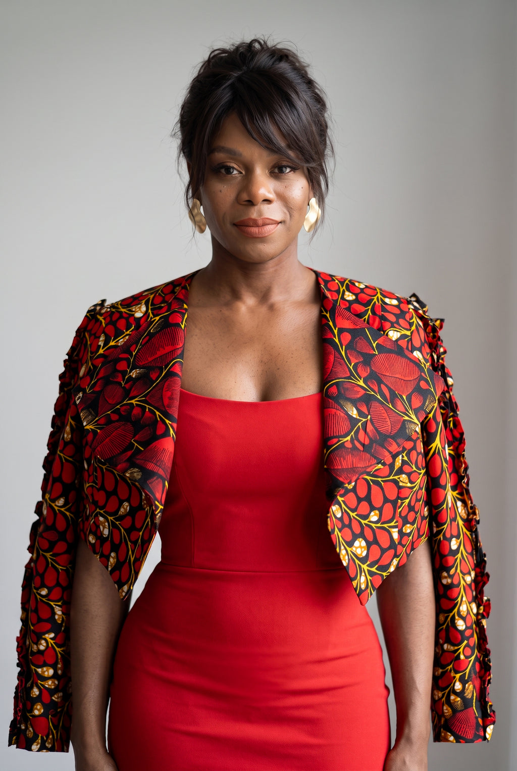 Model wearing Red Vine African print cropped jacket over a simple outfit