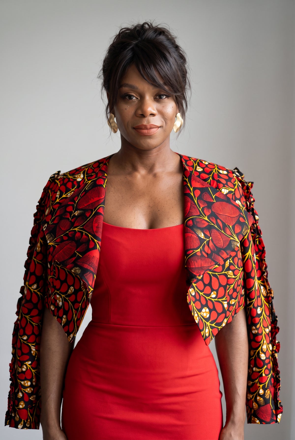 Model wearing Red Vine African print cropped jacket over a simple outfit