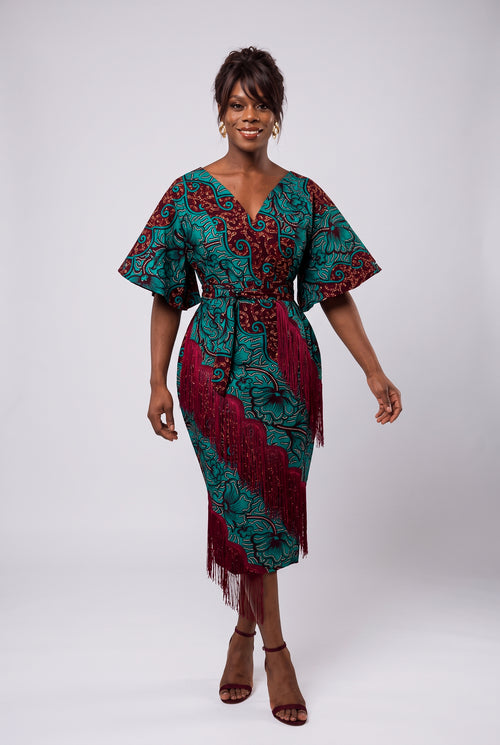 Model walking in Burgundy Oasis African print occasion dress