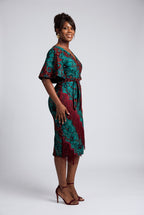 Side view of burgundy teal and gold Ankara midi dress