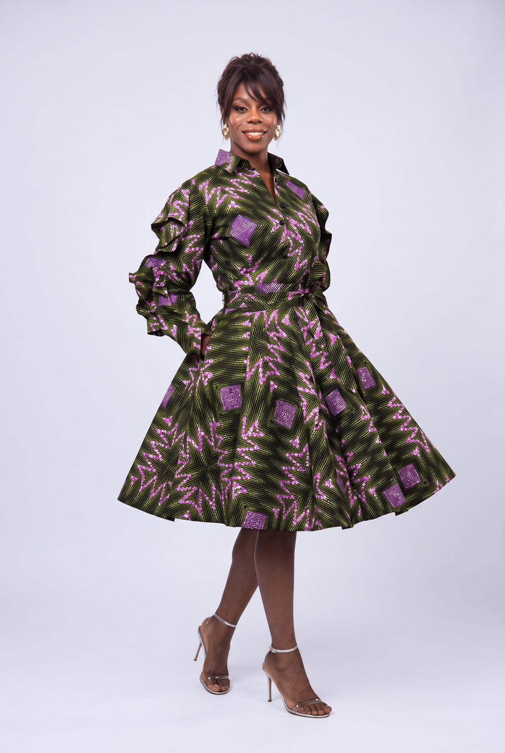Model walking in Olive Ray Ankara shirt dress with side pockets