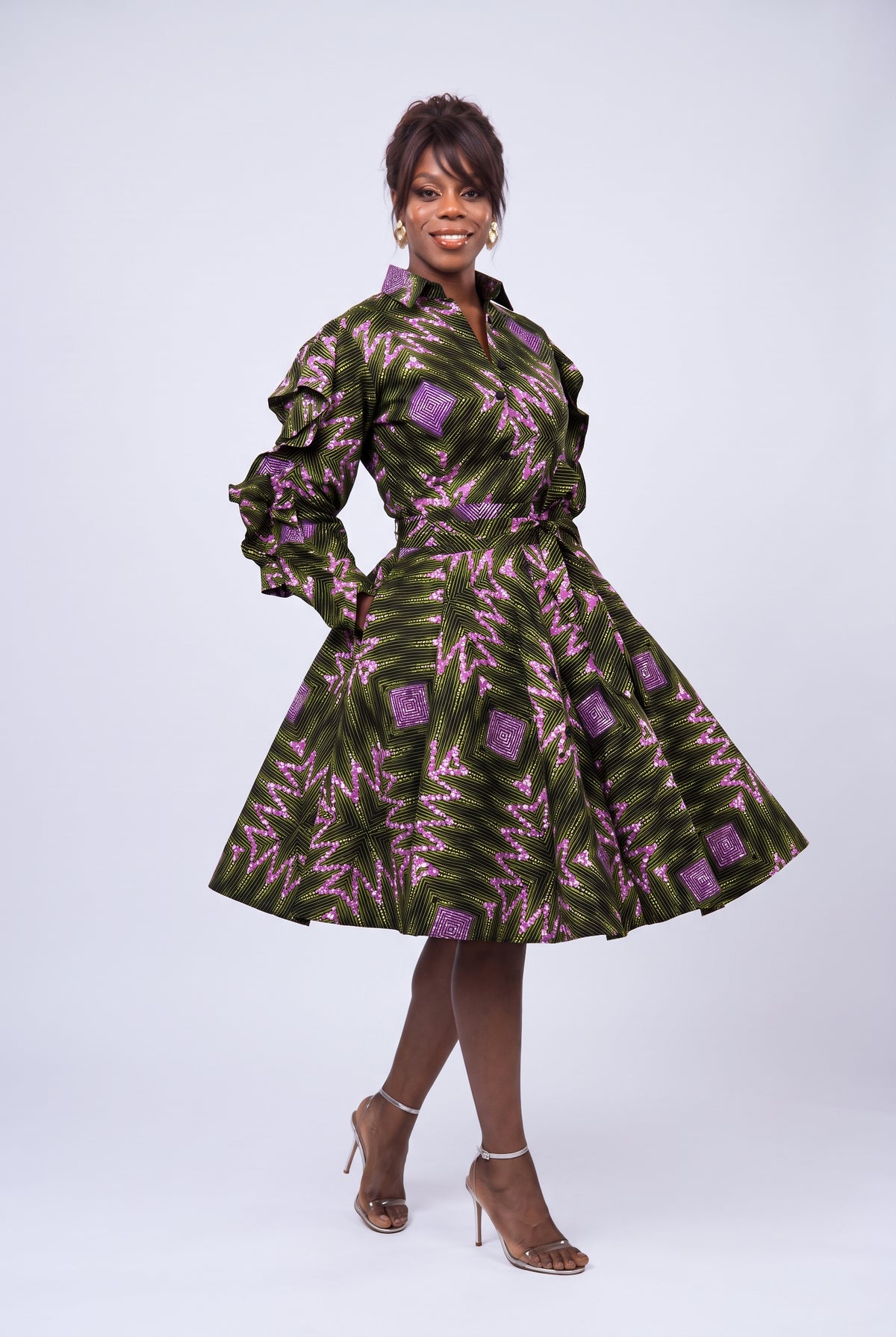 Model walking in Olive Ray Ankara shirt dress with side pockets