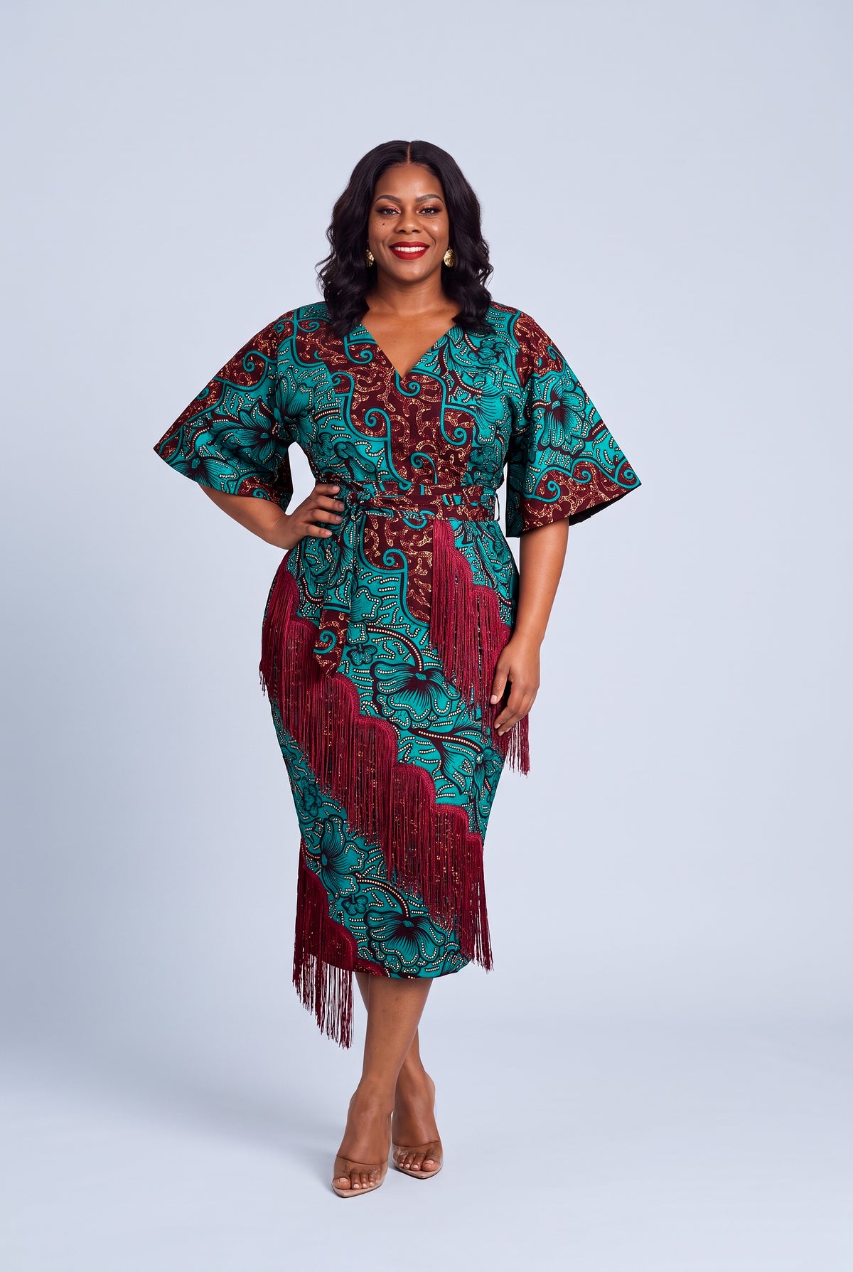 Plus size model wearing Burgundy Oasis Ankara wedding guest dress