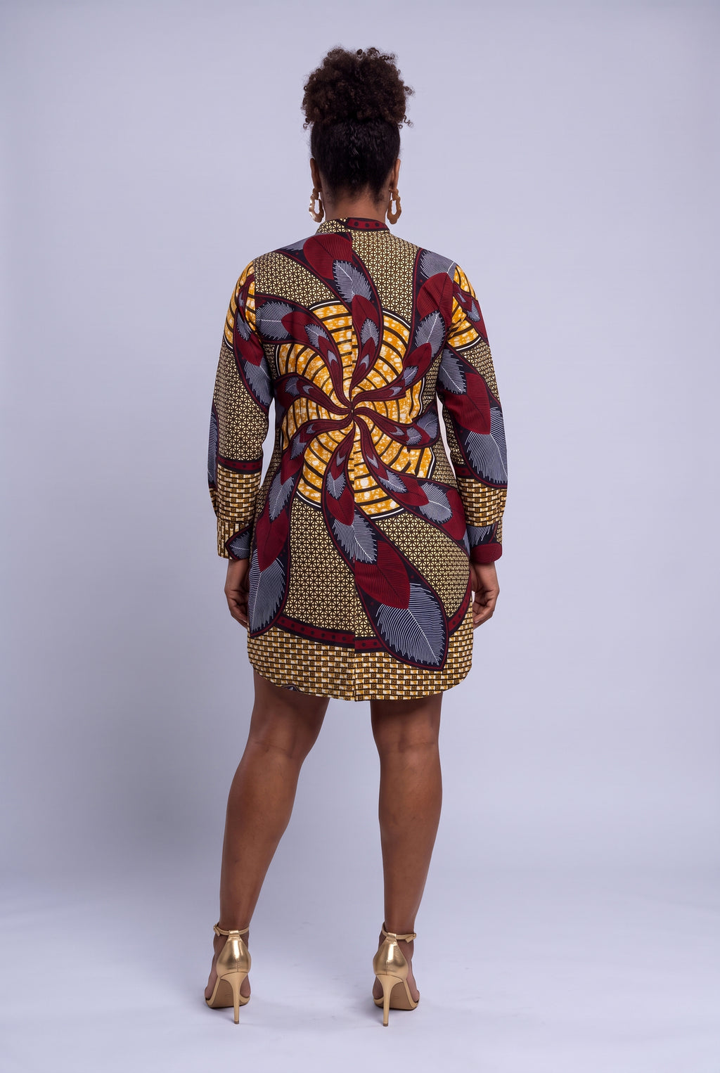 Back view of Burgundy Helix African print shirt dress showing the large burgundy and gold motif