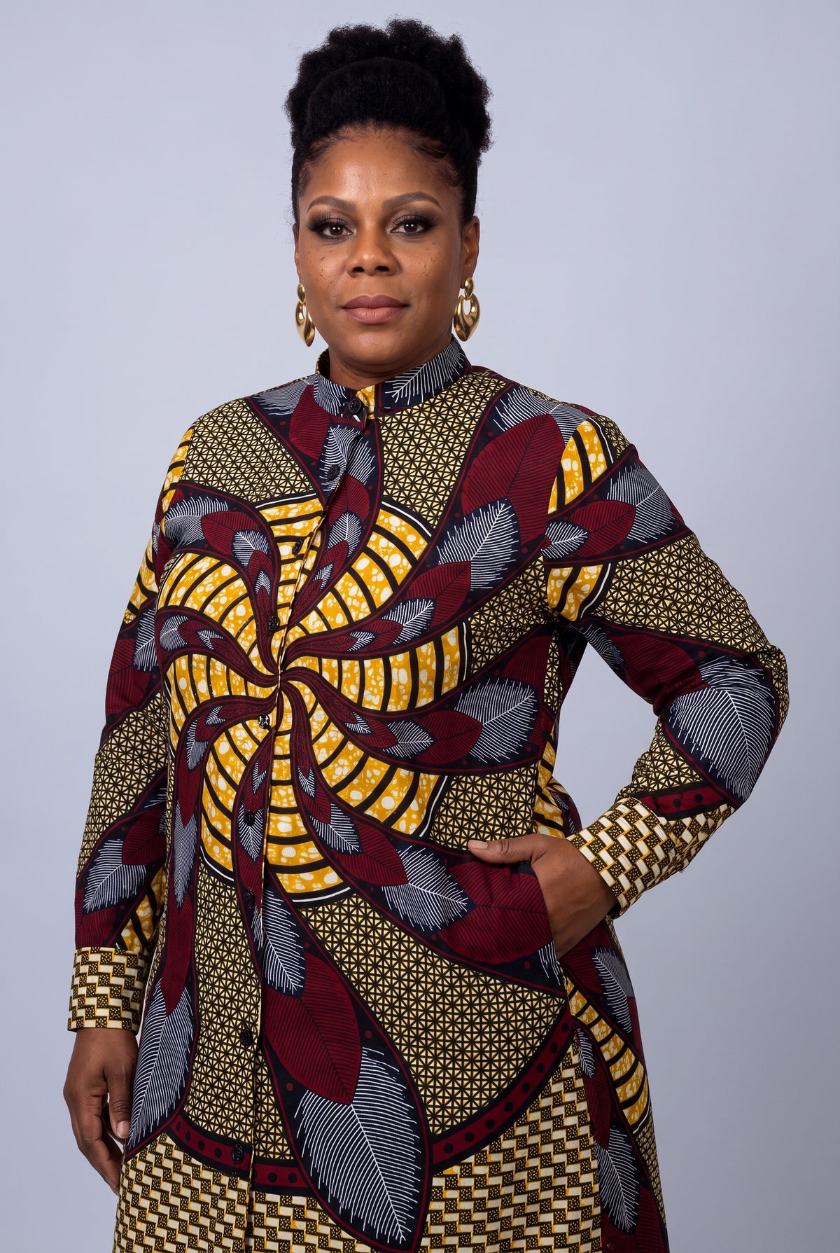  Close side view of Burgundy Helix African print shirt dress in burgundy gold grey and black