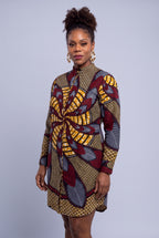 Three quarter view of Burgundy Helix African print shirt dress with stand collar and long sleeves