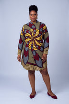  Plus size model wearing Burgundy Helix burgundy Ankara shirt dress with relaxed above-knee fit