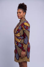 Side profile of plus size model wearing Burgundy Helix African print shirt dress