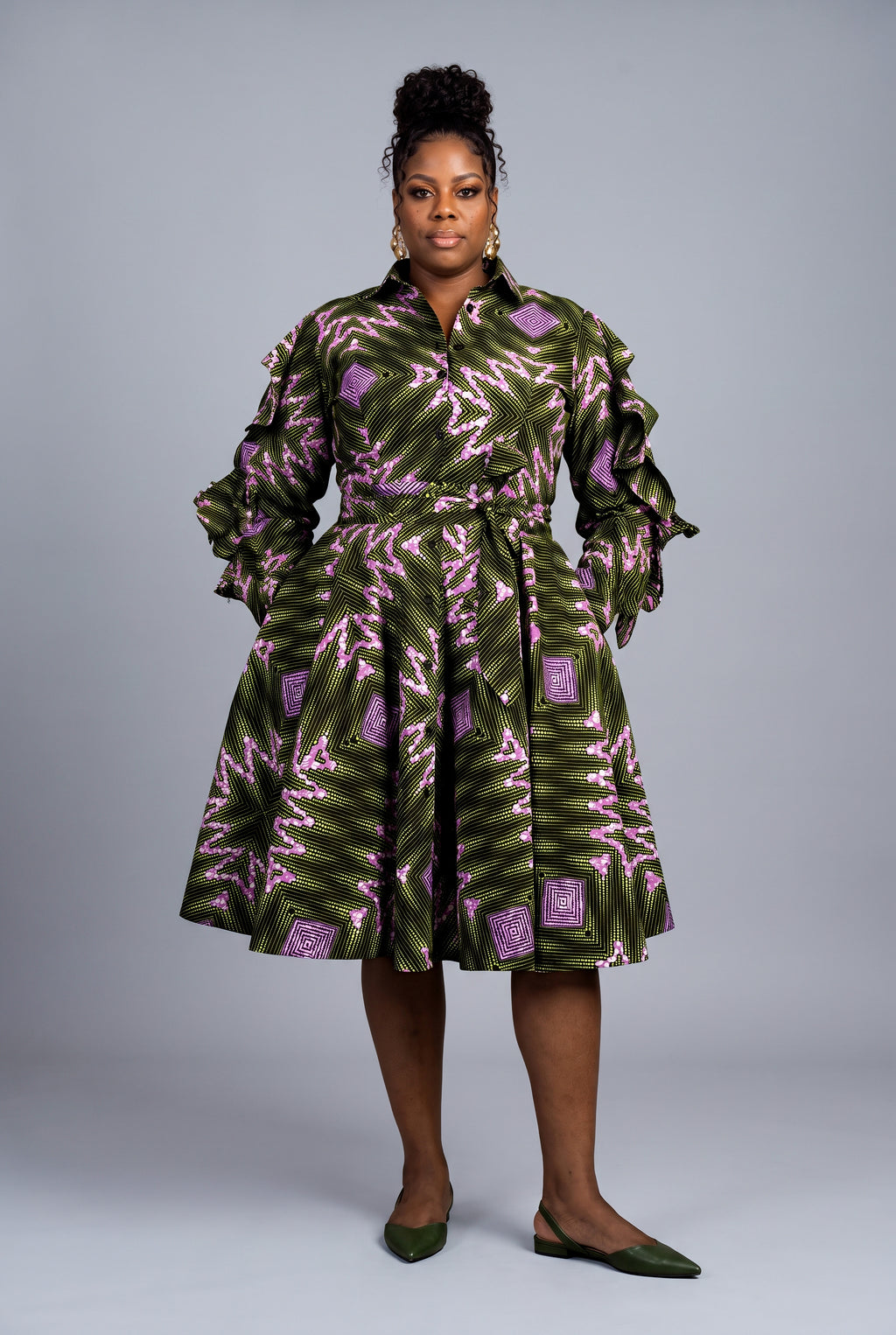 Plus size model wearing Olive Ray green Ankara shirt dress