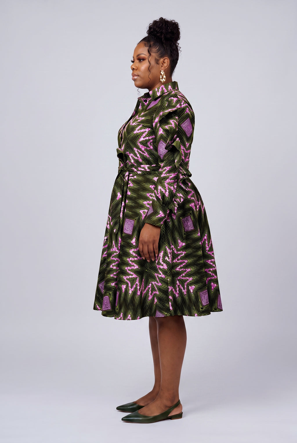 Side view of green African shirt dress showing ruffle sleeve detail