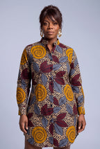 Close front view of Ochre Grove brown African print shirt dress with ochre yellow circles and burgundy leave