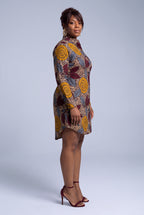 Side view of Ochre Grove long sleeve Ankara shirt dress with relaxed straight fit and curved hem