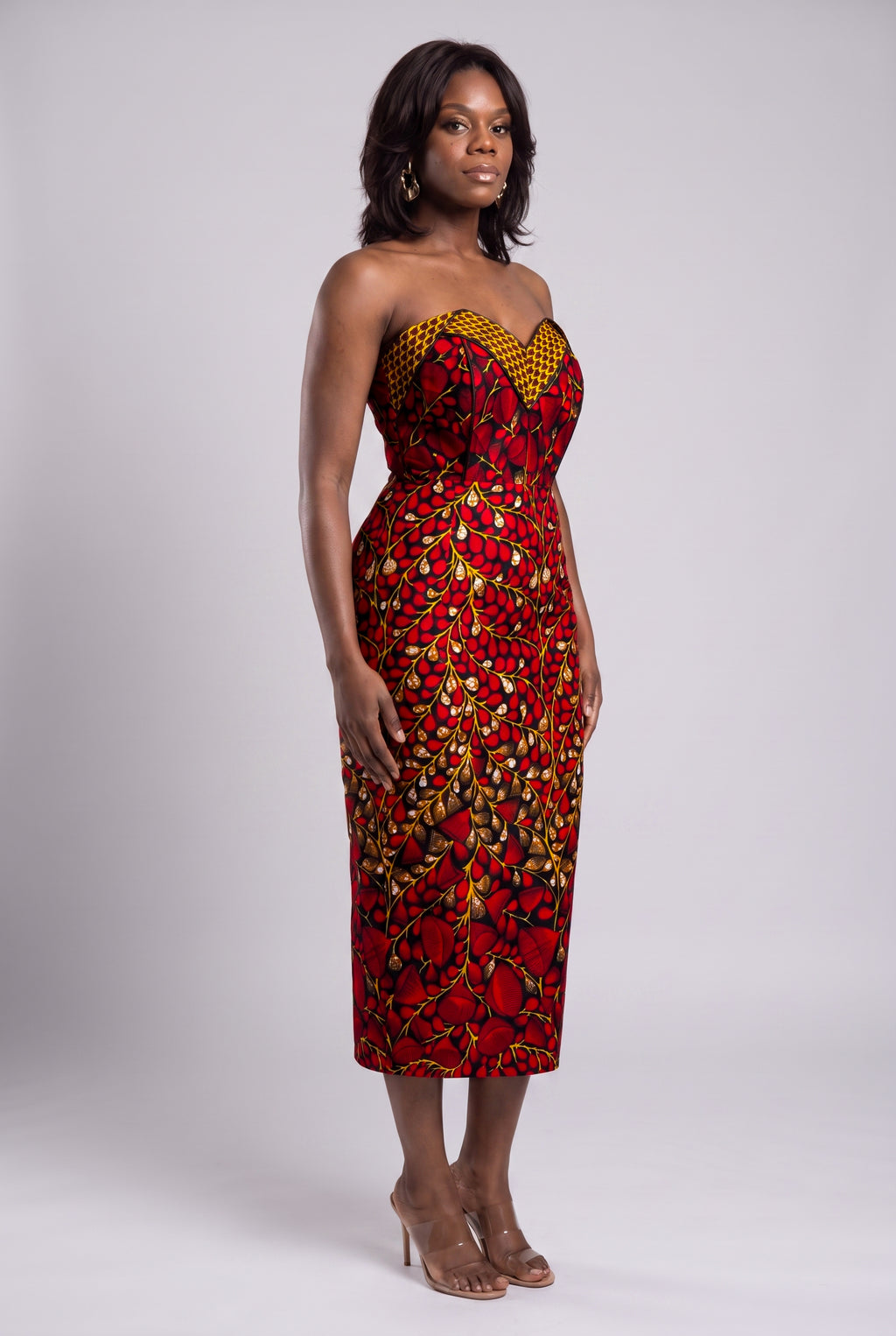 Side view of red and black Ankara corset dress