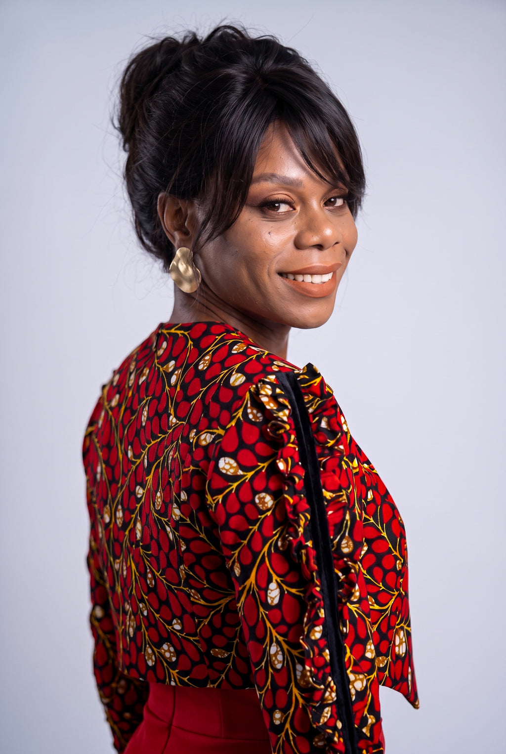 Side view of red and black Ankara cropped jacket