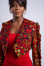 Detailed view of structured lapel collar and single button front closure on an African print cropped blazer