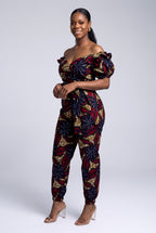 Side view of navy and red Ankara wrap top and trouser set