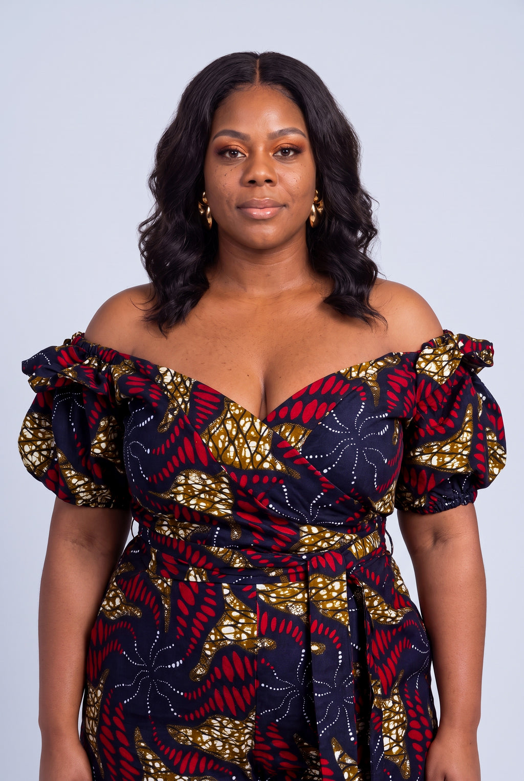 Close up of Ruby Nova off shoulder wrap top and waist tie