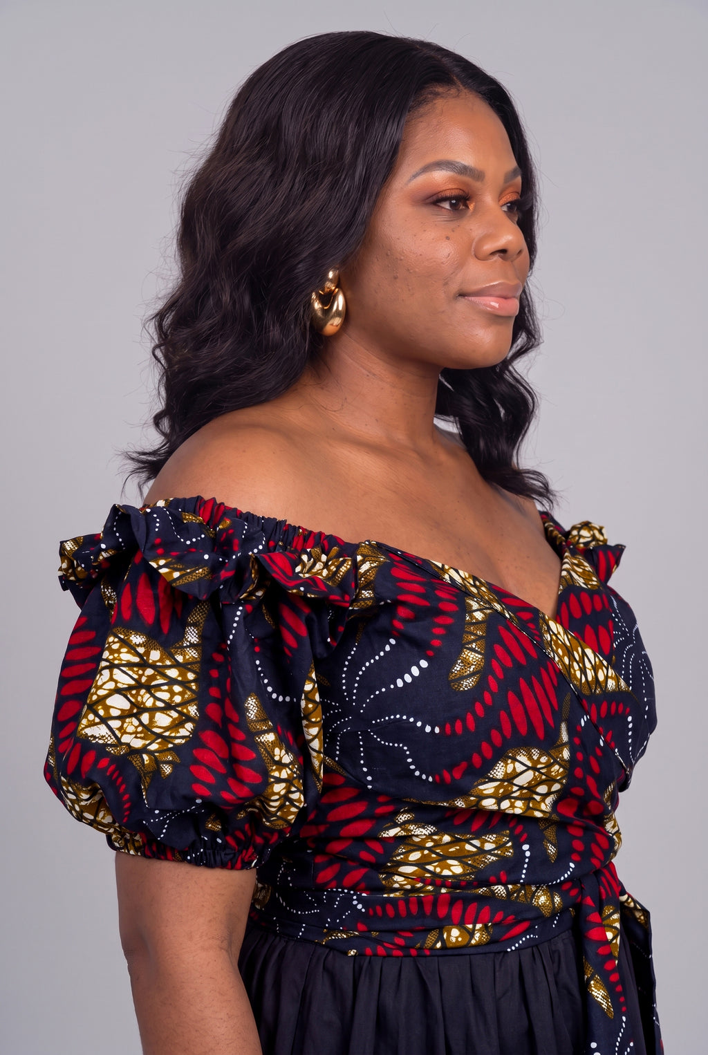 Close up side view of navy and red Ankara wrap top