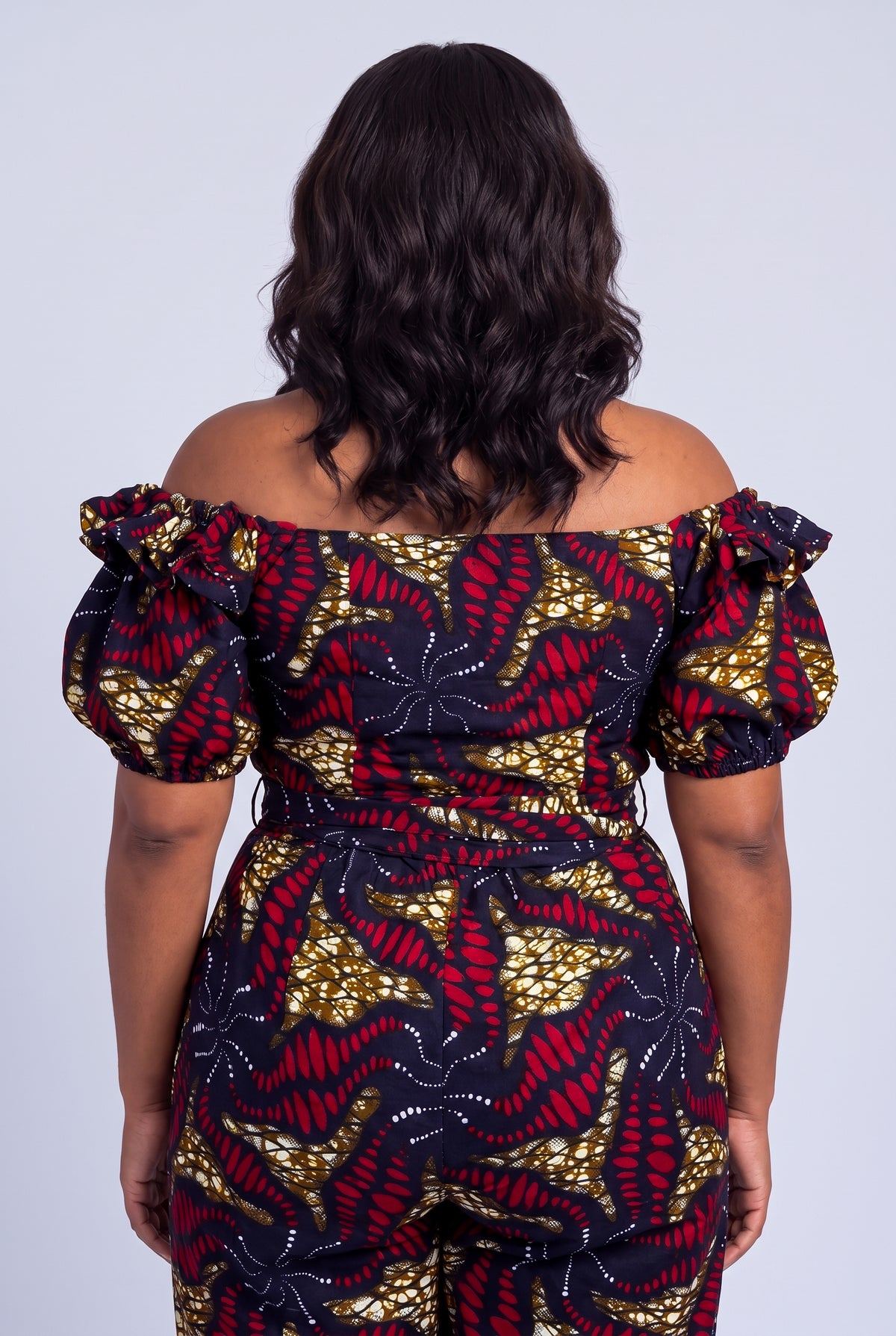 Back view of navy Ankara wrap top and matching trousers