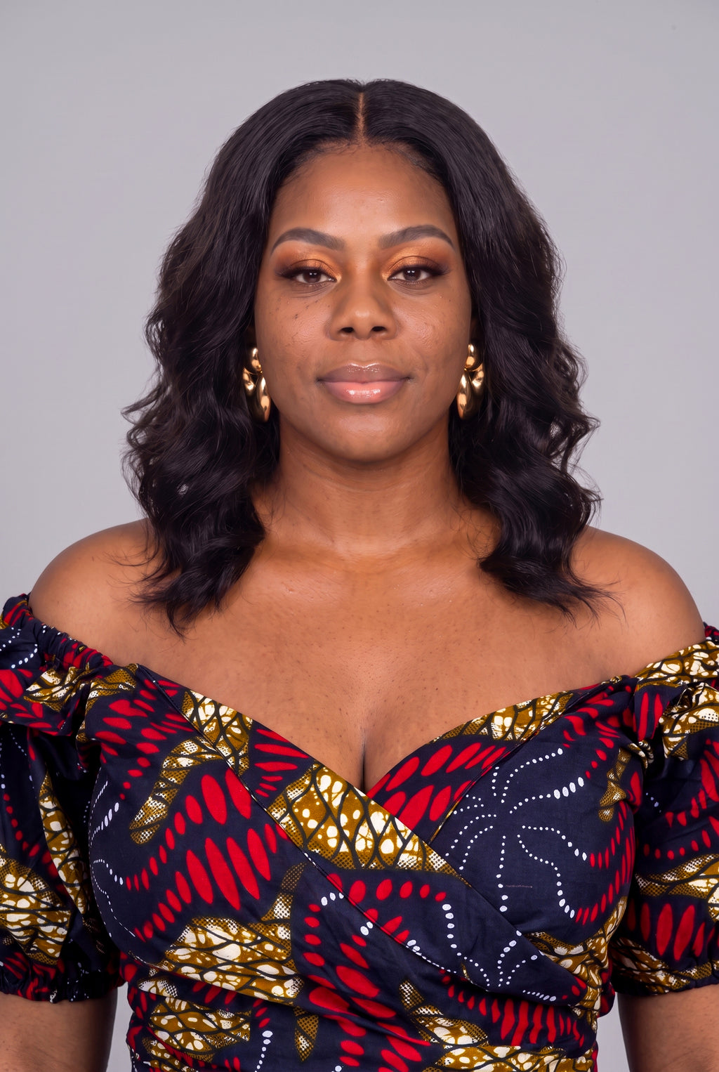 Close up of Ruby Nova off shoulder wrap neckline and ruffle detail