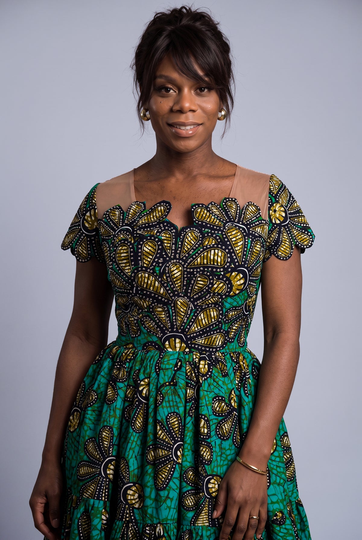 Close up of Teal Flora rhinestone embellished African Print skater dress 

