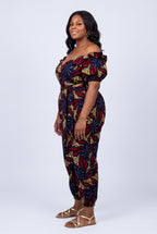 Side view of navy and red Ankara wrap top and trouser set