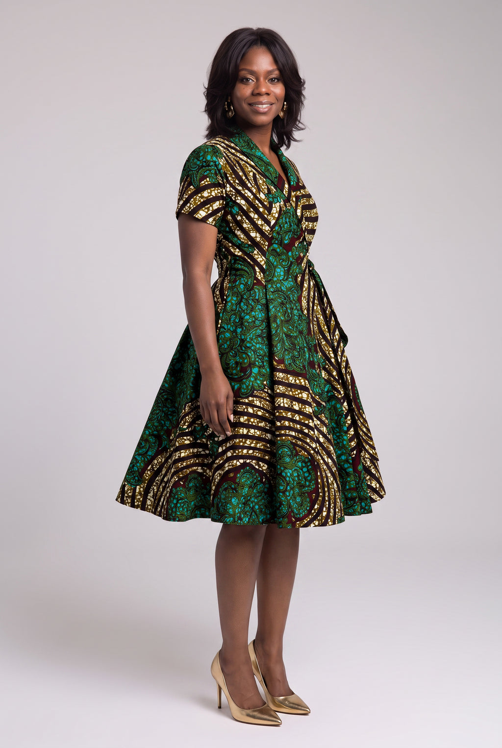 Side view of green gold and burgundy Ankara wrap midi dress