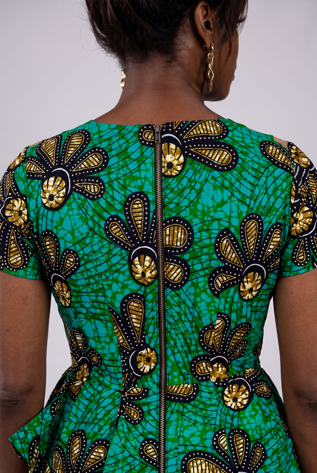 Back view of teal gold and black Ankara wax print fabric