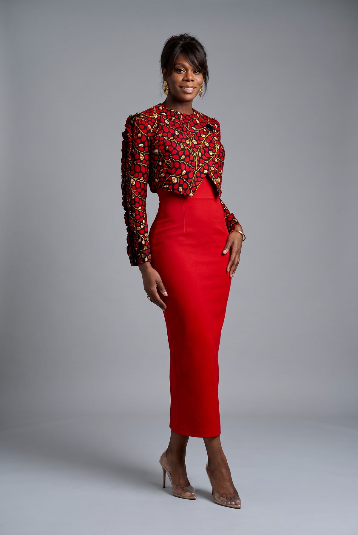 Full length styling view of red African print jacket with fitted dress